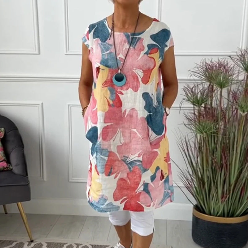 Avslappnad lång topp med färgglada blommönster